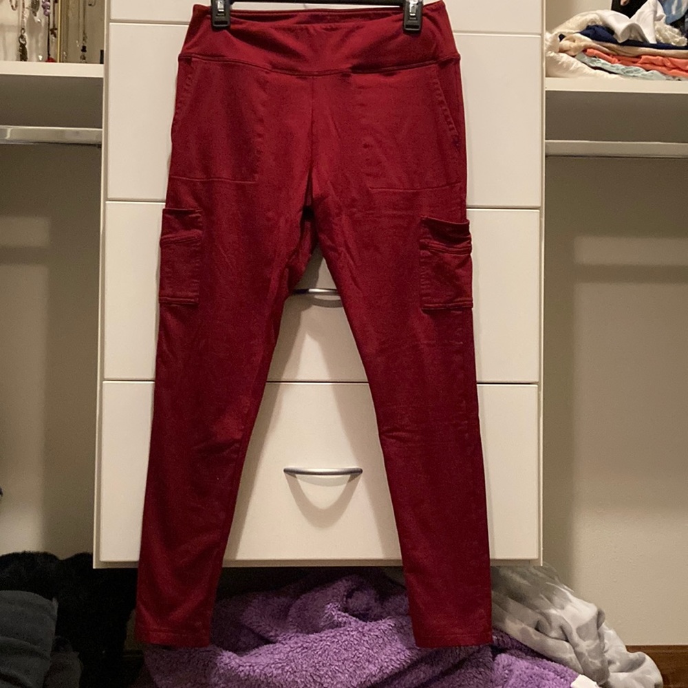 Dark red leggings with pockets and lined with fleece on inside